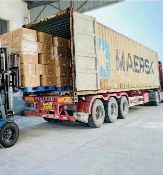 Loading cartons into a shipping container